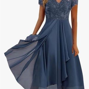 Elegant mid length dress.   Blue.  Size Small. Never worn